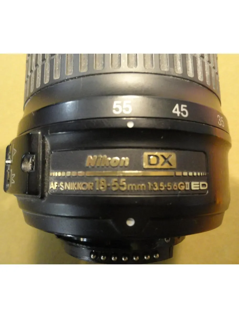 NIKON DX SWM ED ASPHERICAL 0.28M/0.92FT 52 US 6766543 18-55 MM 1:3.5-5.6 G II
